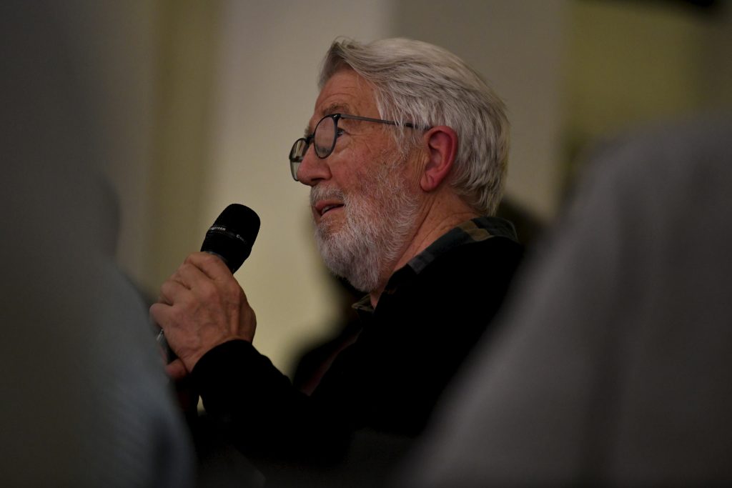 an audience member asks a question