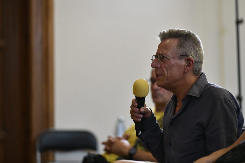 an audience member poses a question