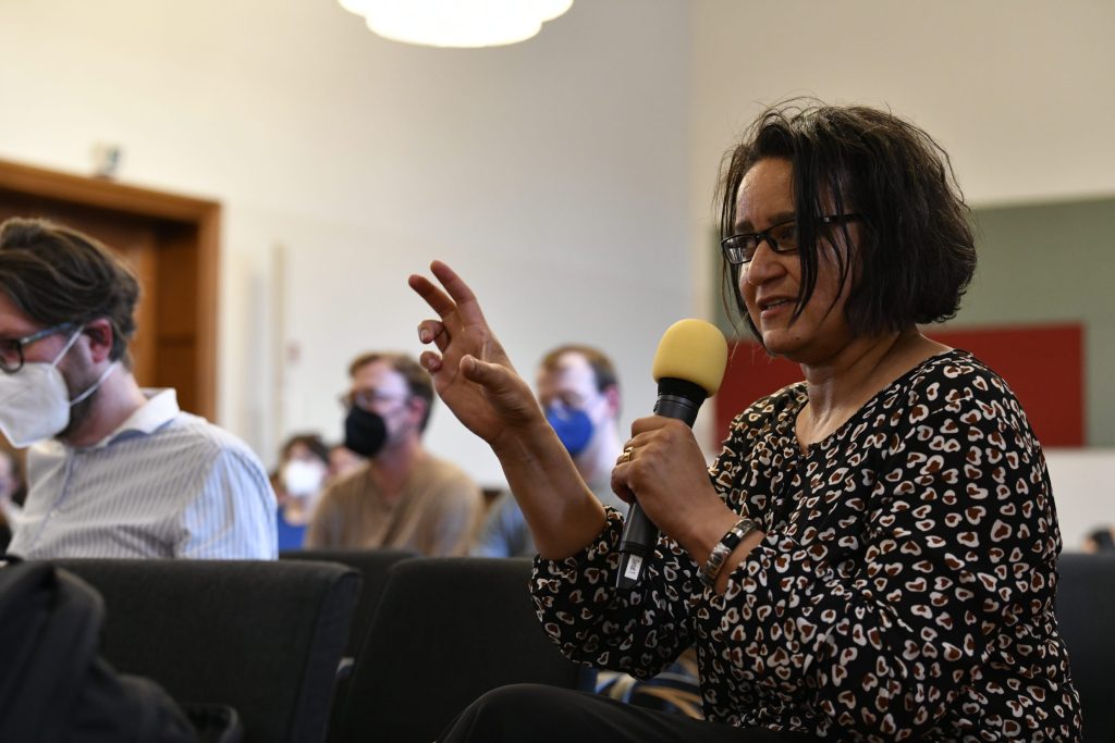 an audience member poses a question