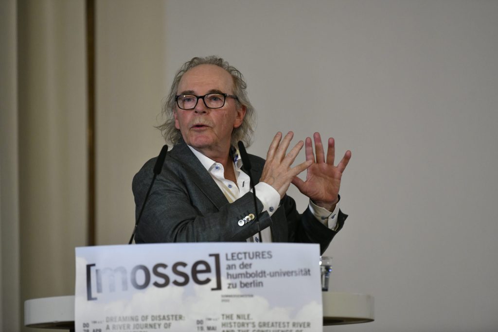 Tvedt lectures at the podium