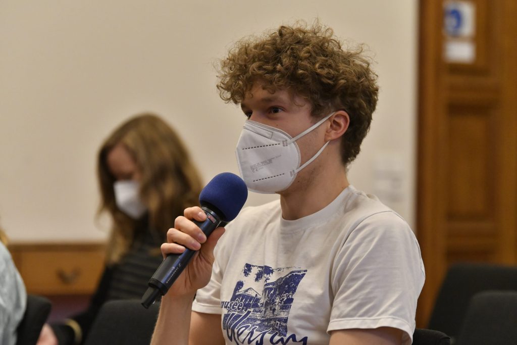 An audience member asks a question