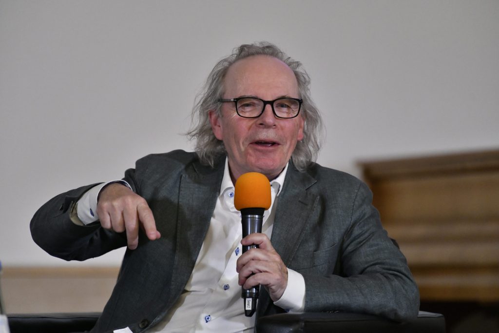 A smiling Tvedt responds to a question
