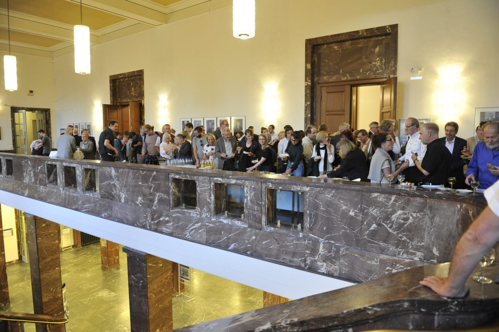 audience members mingle outside the Senatsaal