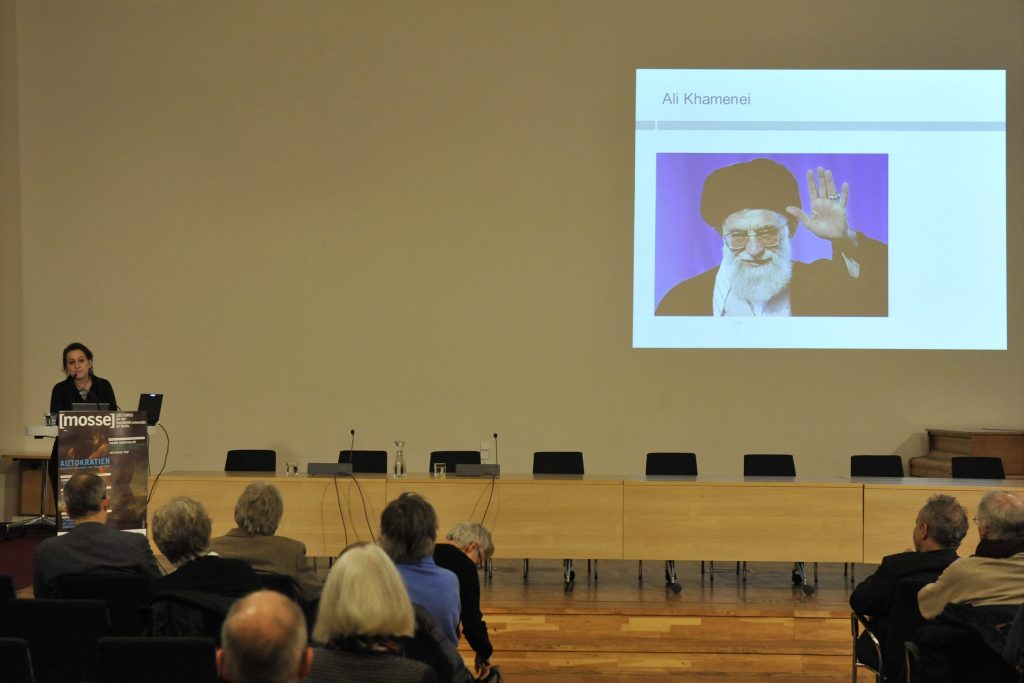 Amirpur delivers her lecture with slide of Khamenei in the background