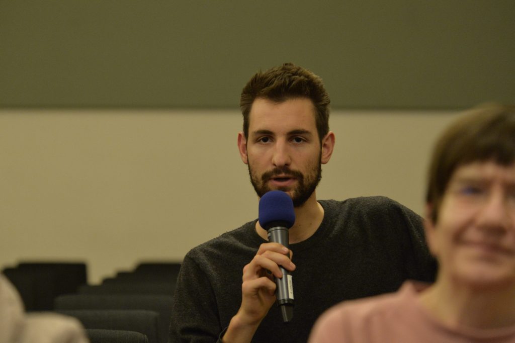an audience member poses a question