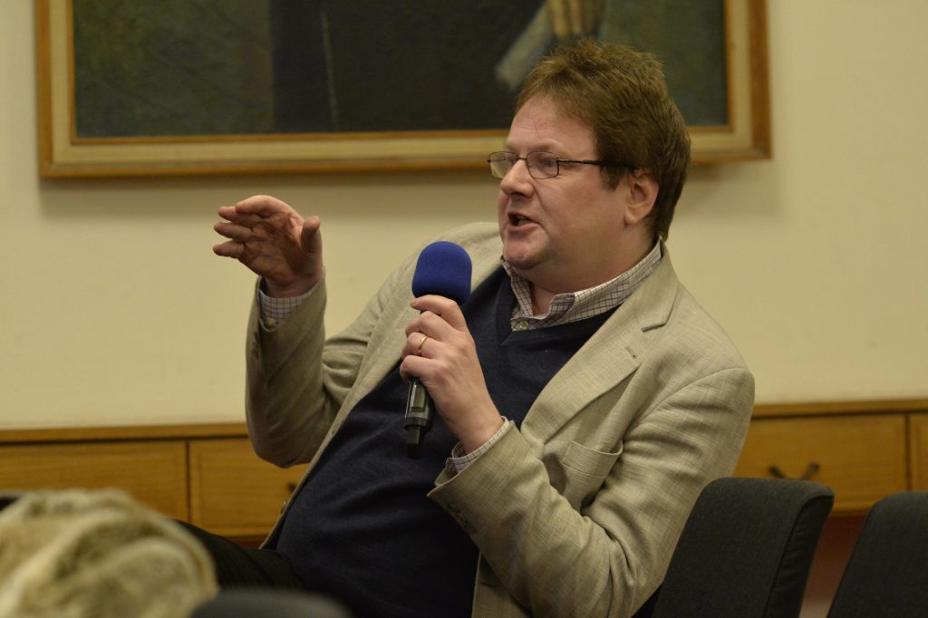 an audience member asks a question