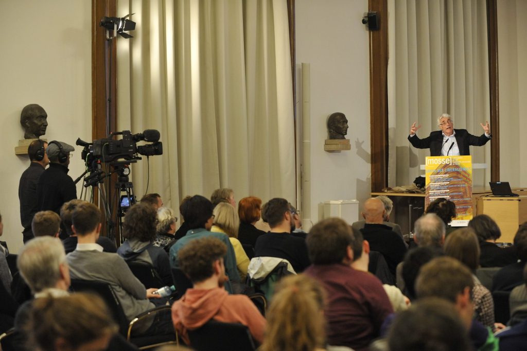 the audience listens to the lecture