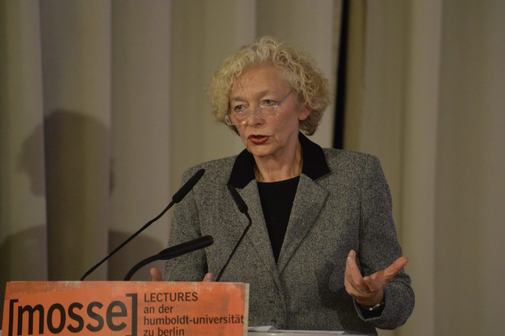 Weigel speaks at the podium