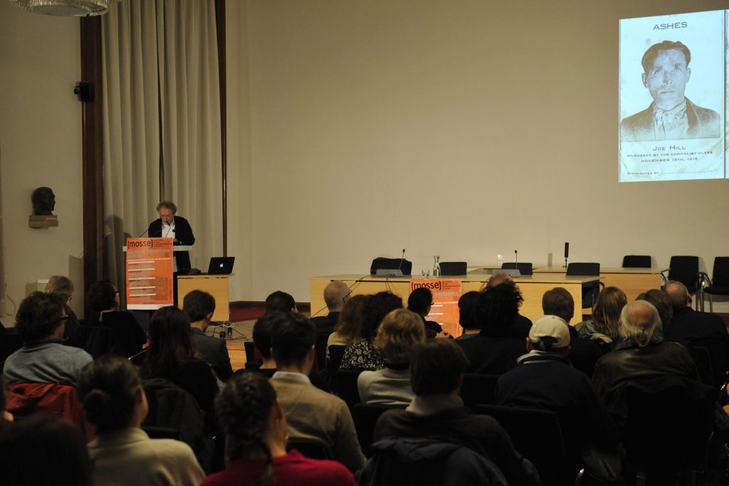 Huberman delivers his lecture as the audience listens
