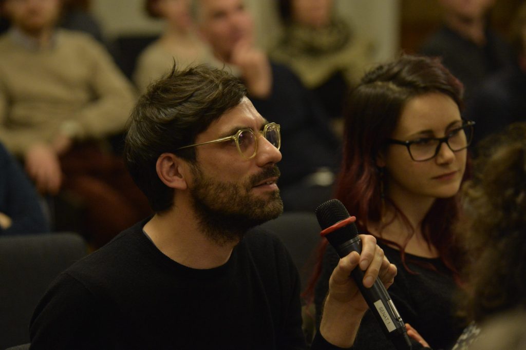 an audience member asks a question