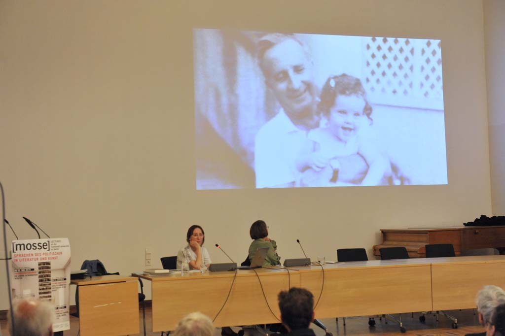 a slide displays a picture of a man holding a young girl