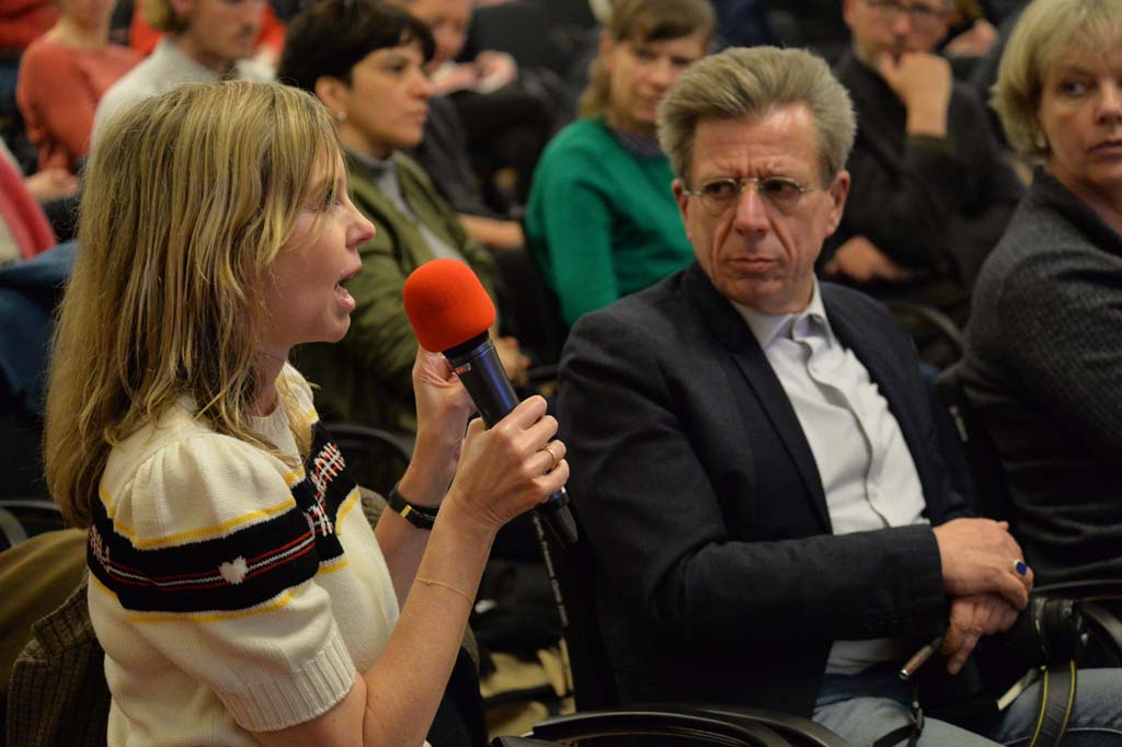 an audience member asks a question