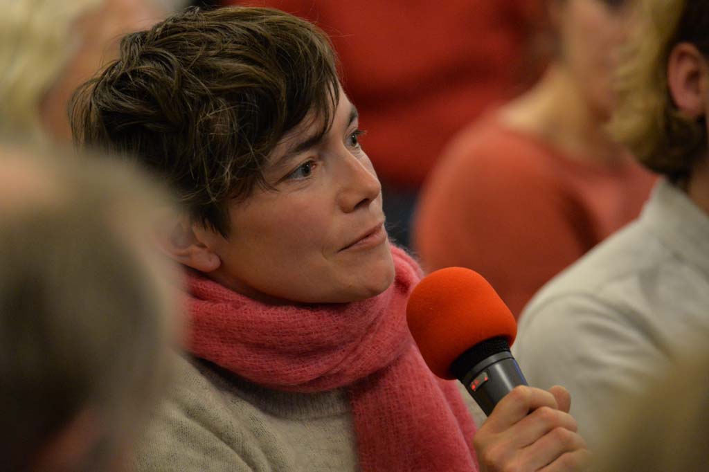 an audience member asks a question
