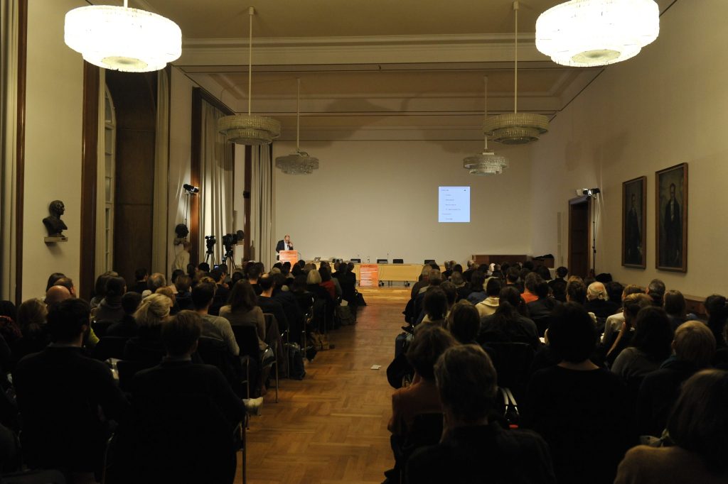 the audience listens