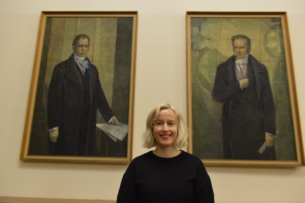 Walshe in front of the portraits of the Humboldt brothers