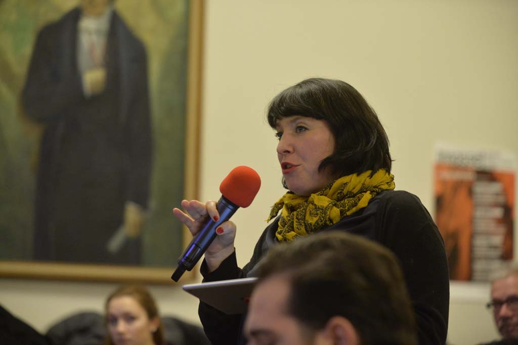 an audience member asks a question