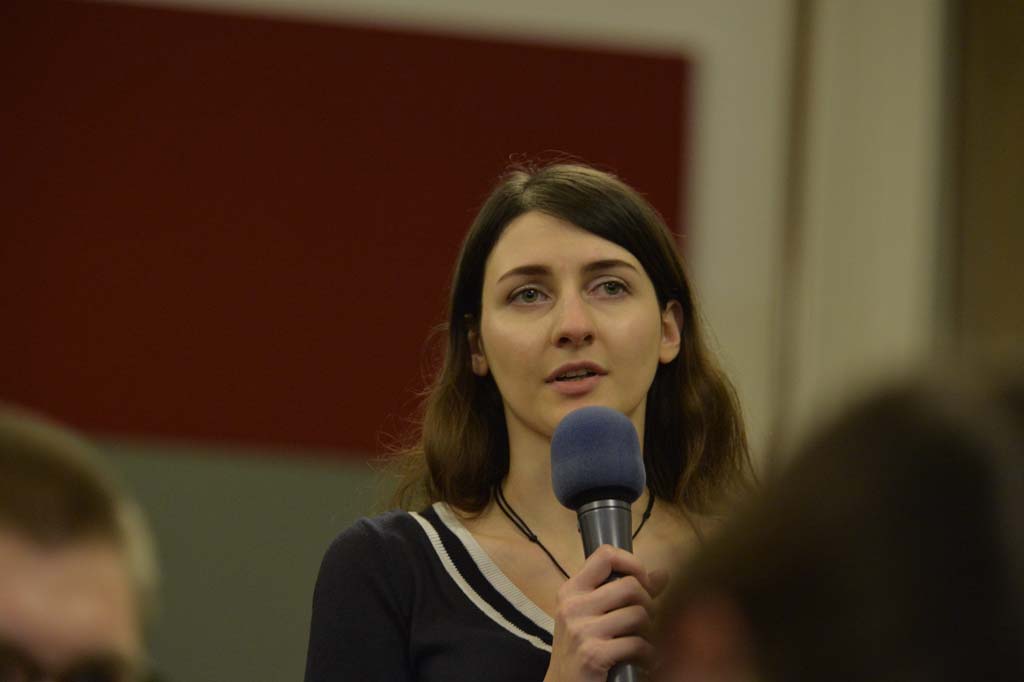 an audience member asks a question