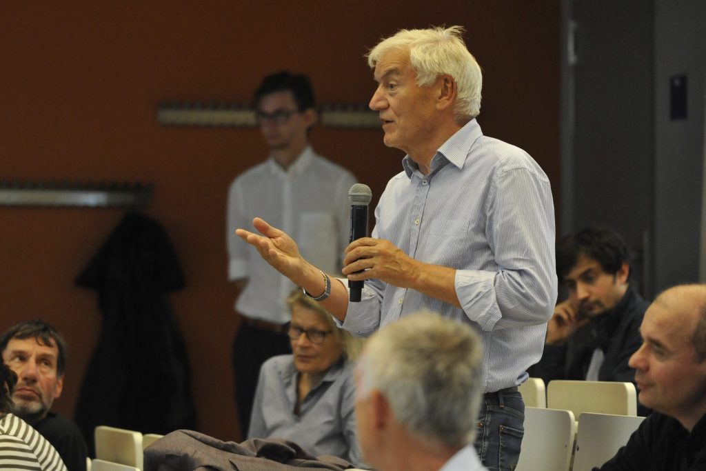 an audience member asks a question