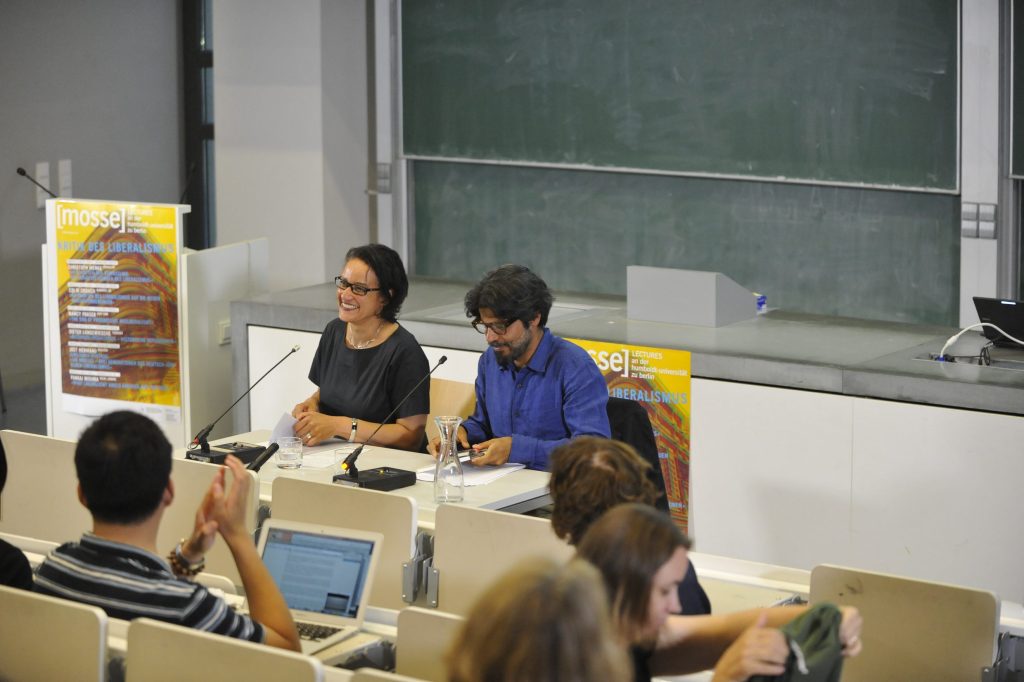 Mishra and de Mazza address the audience