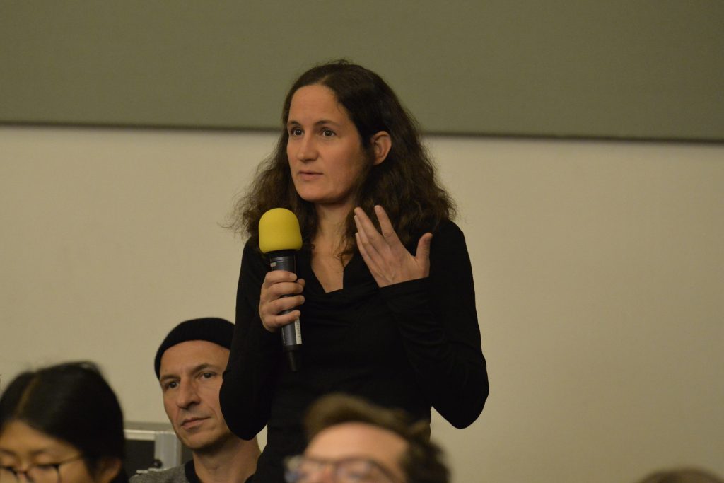 an audience member asks a question