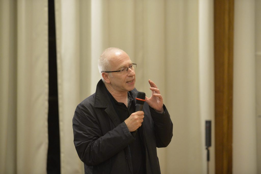 an audience member asks a question