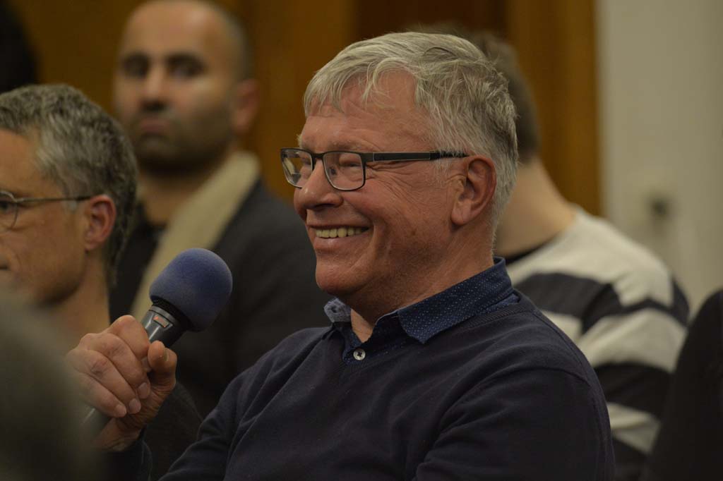 an audience member asks a question
