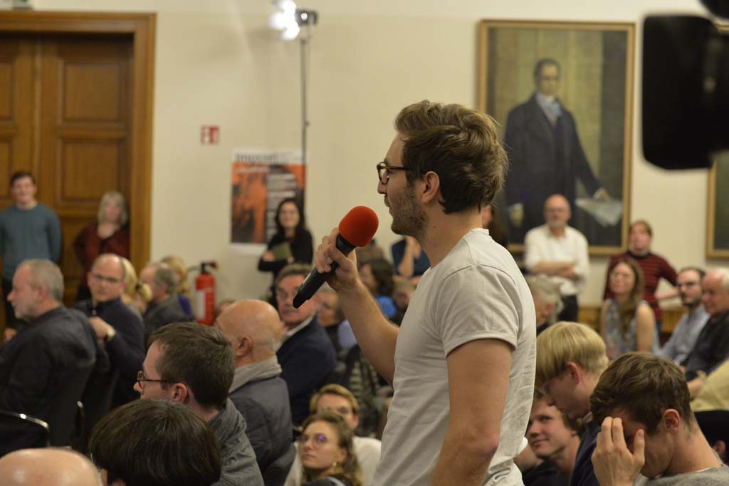 an audience member asks a question