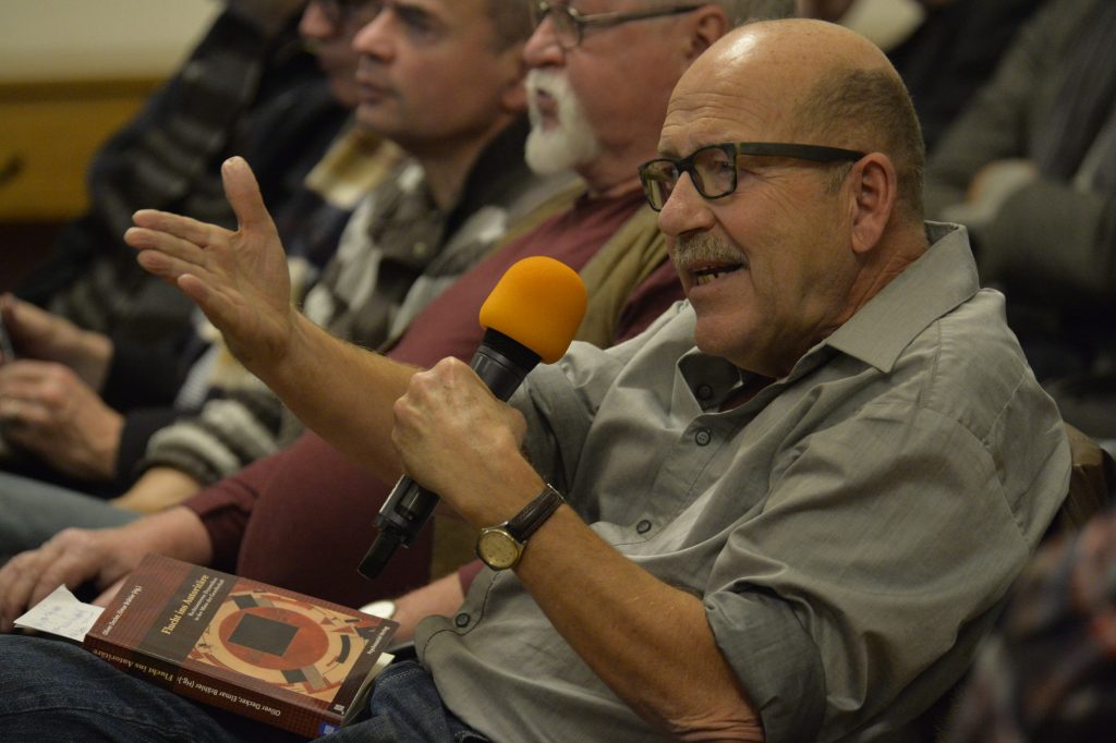 an audience member asks a question