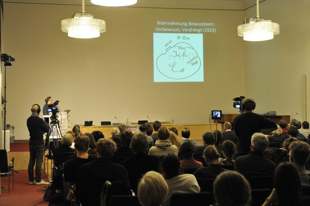 the audience looks on