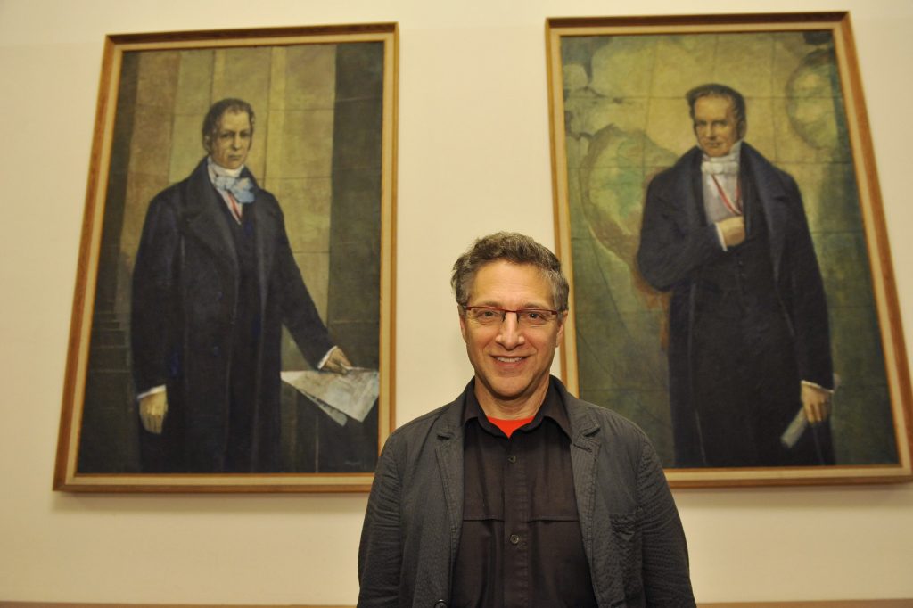 Galison in front of the portraits of the Humboldt brothers