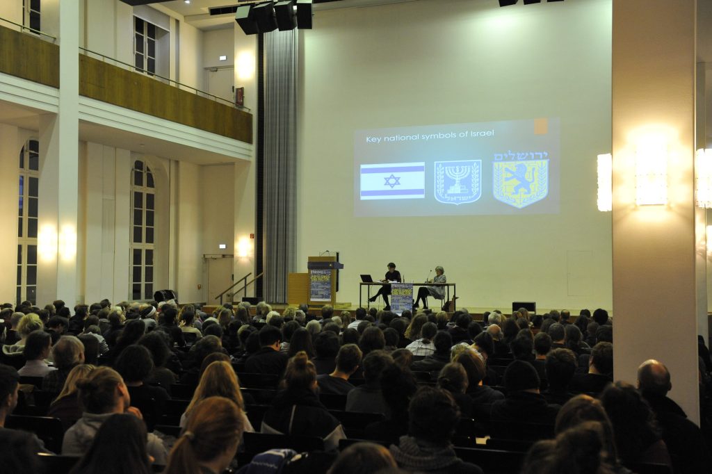 the audience listens