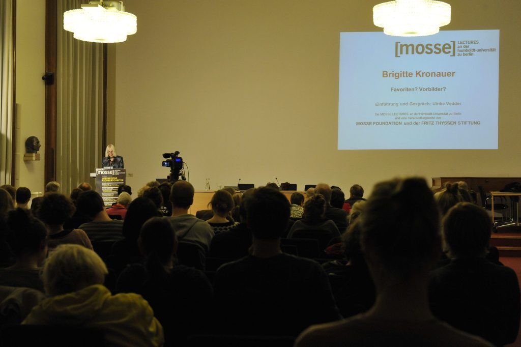 the audience looks on