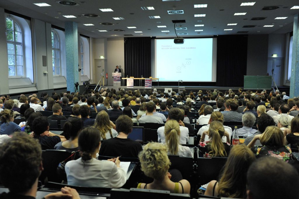 a full audience looks on