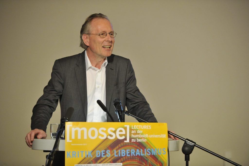 Menke lectures from the podium