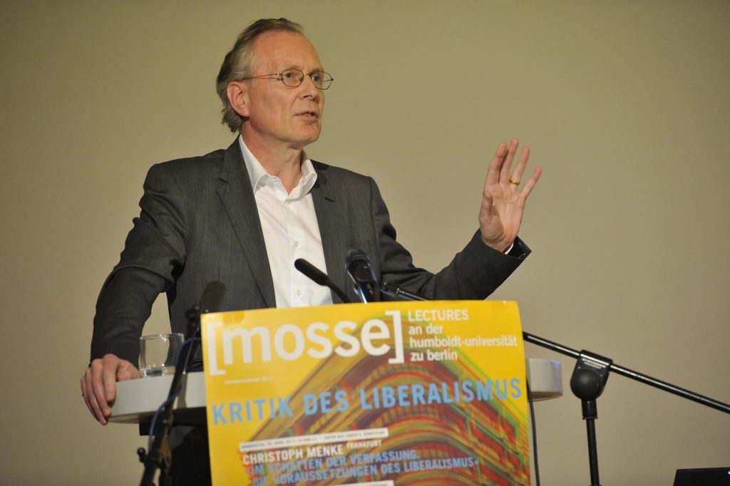 Menke delivers his lecture at the podium