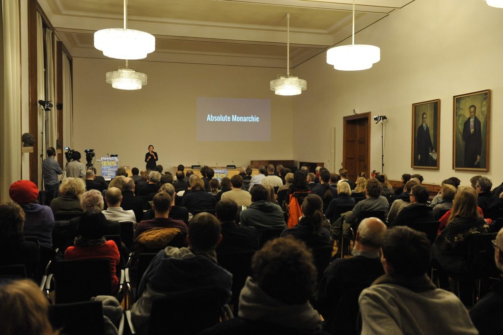 the audience listens