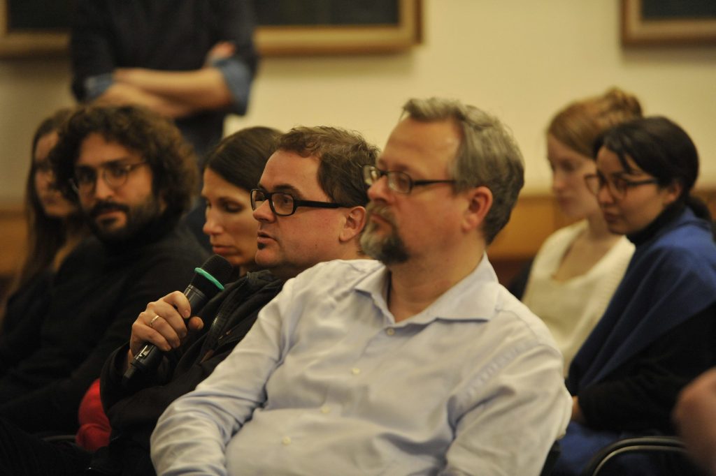an audience member asks a question