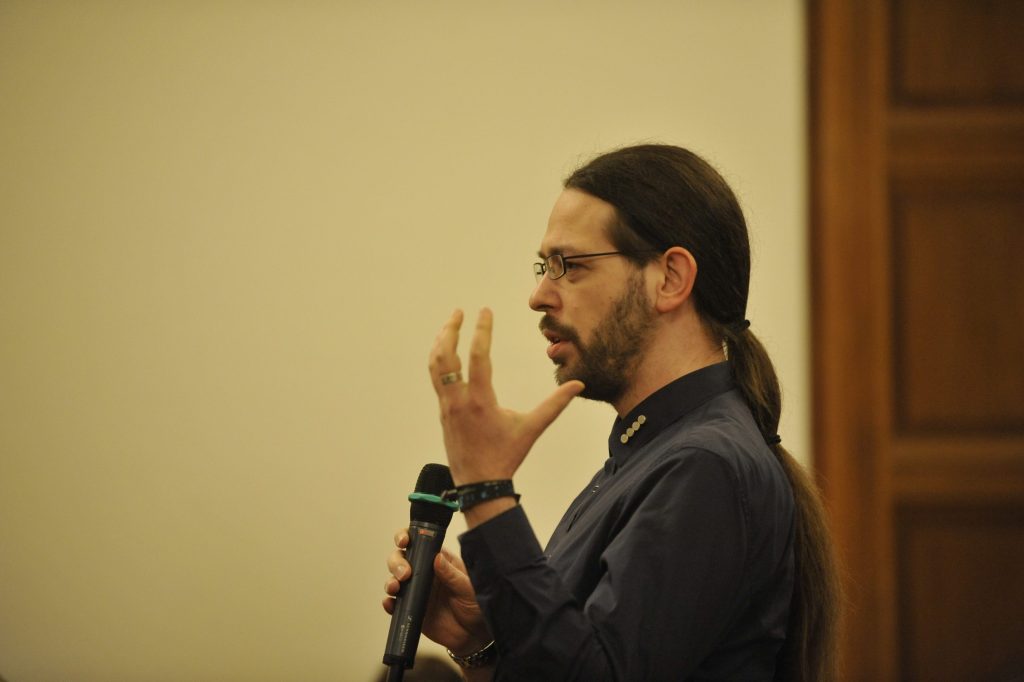 an audience member asks a question