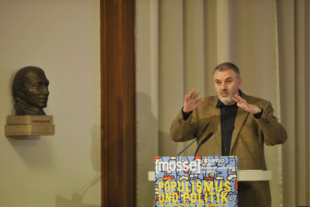 Stavrakakis delivers his lecture from the podium
