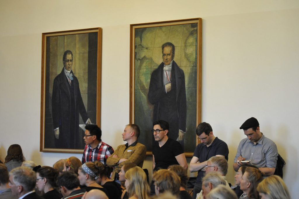 the audience looks on
