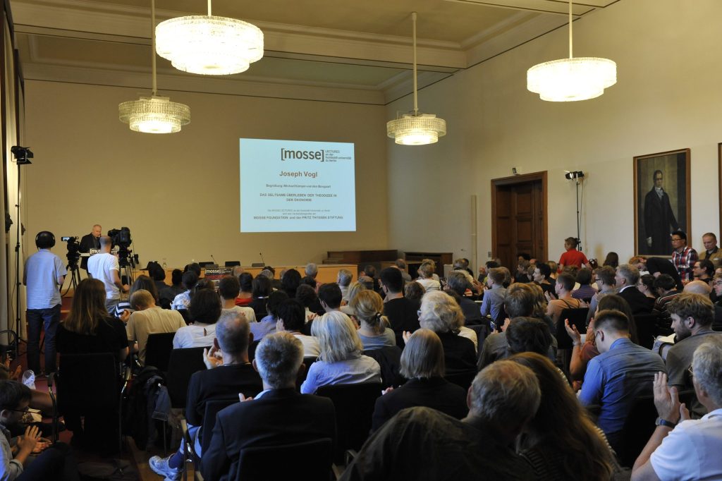the audience watches the lecture