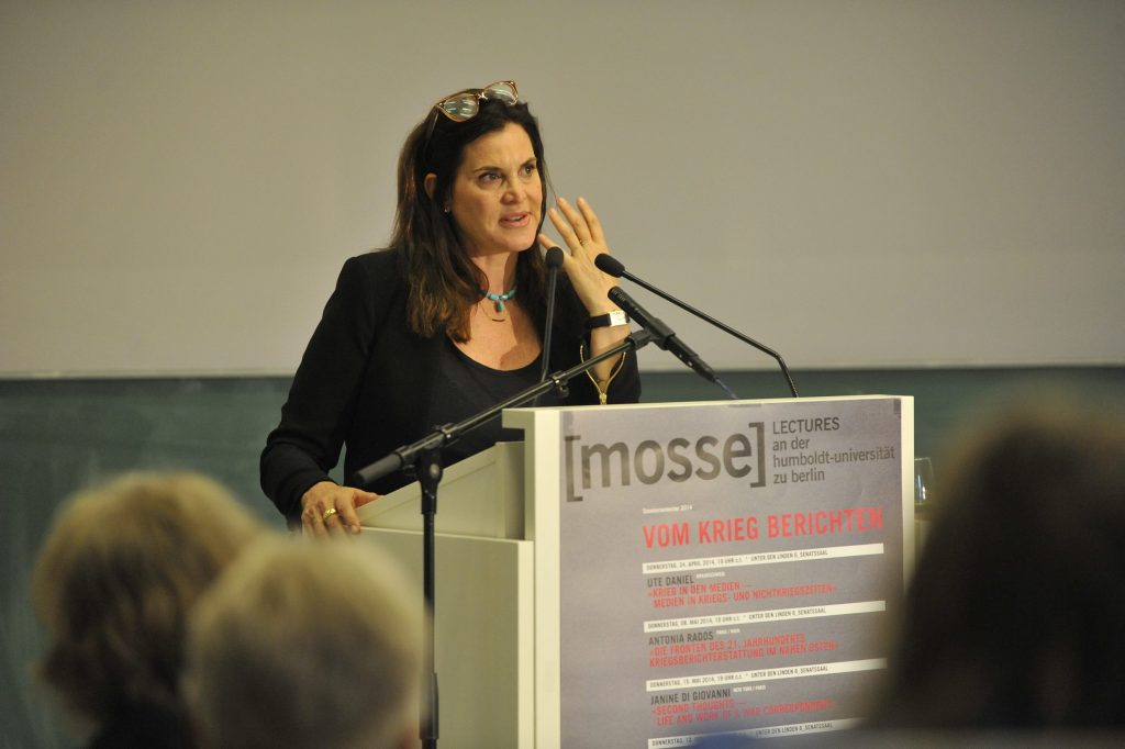 Giovanni lectures from the podium