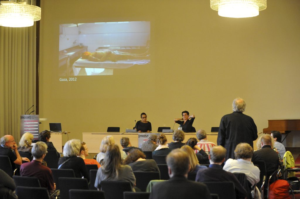 the audience looks on