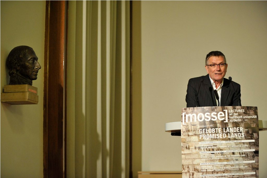 Armbruster lectures from the podium
