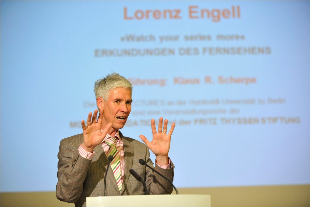 Engell lectures from the podium
