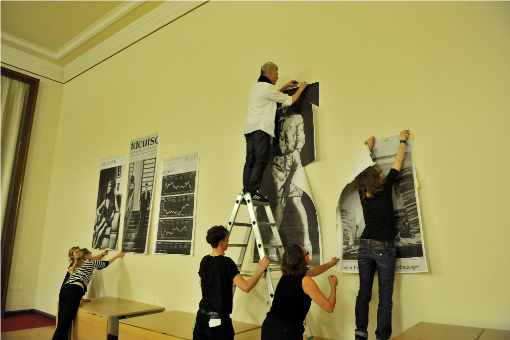 staff put up posters on the wall