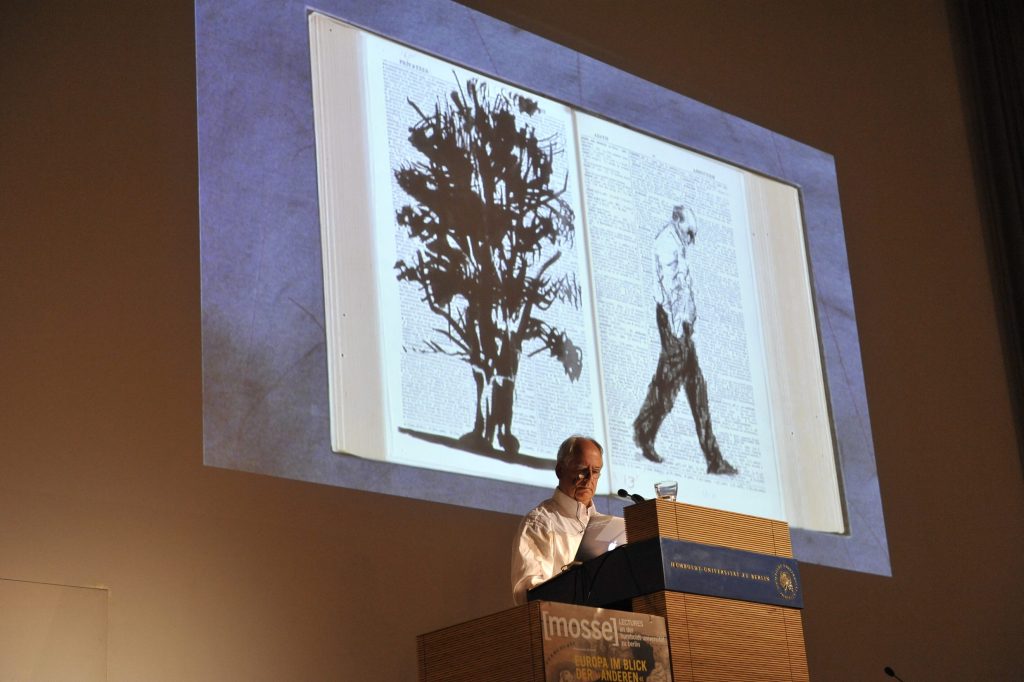 Kentridge with image of a tree and a man in the background
