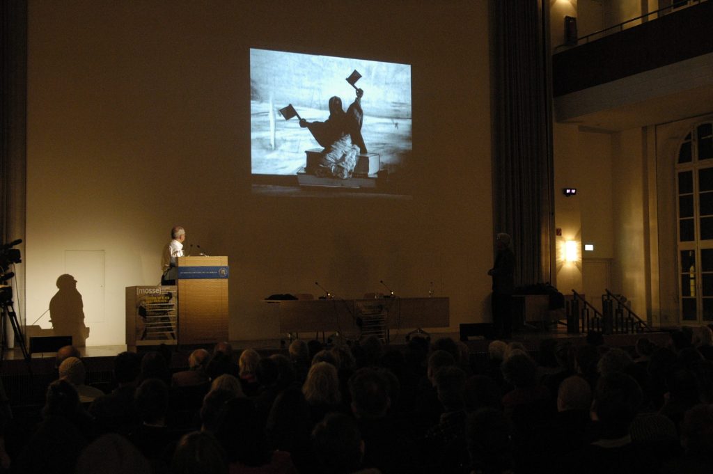 the audience looks at a slide