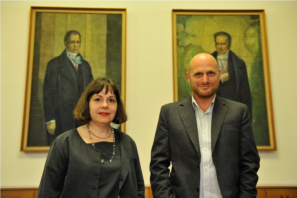 Levi and Bronfen pose in front of the portraits of the Humboldt brothers