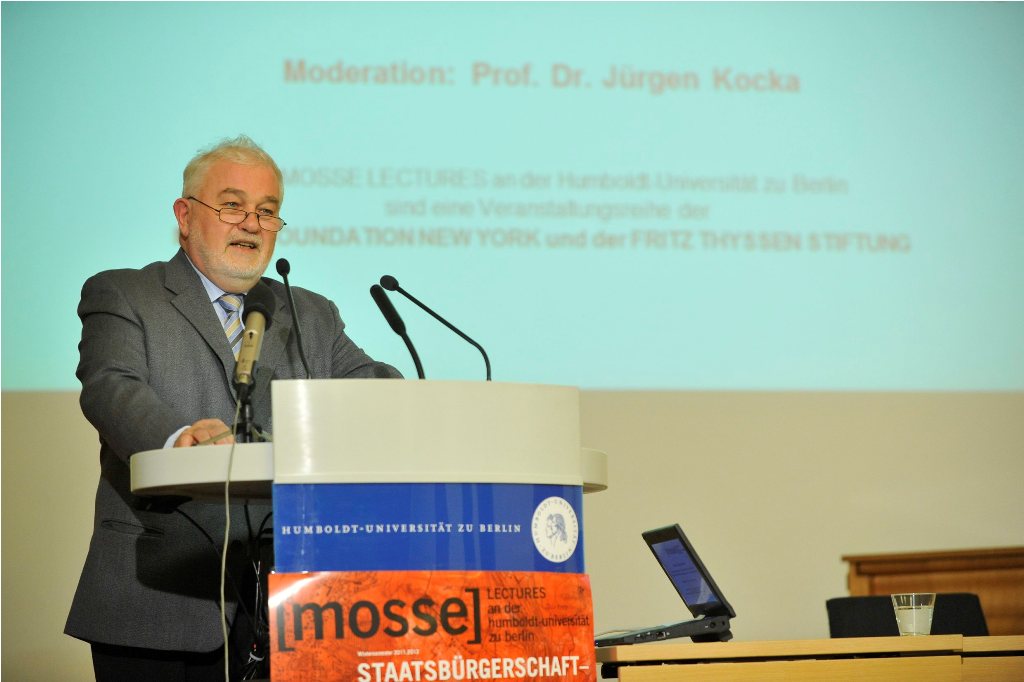 Kocka speaks from the podium